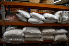 A large quantity of pillows and related items to include the fine Bedding Company and Emma.