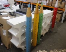 Four children's themed glasses display units, a counter unit and a large picture.