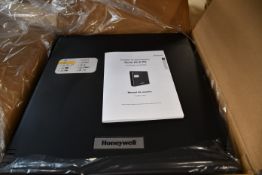 A boxed as new Honeywell HLSPS50 EN54-4 4V 5Ah Power Supply Unit (Box opened).