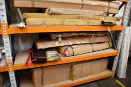 Three shelves of miscellaneous items to include trolleys, poster stands and card stand.