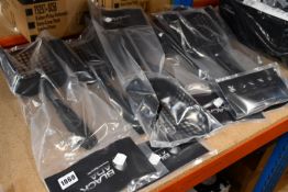 Seven as new Black Ada stainless steel sand scoops.