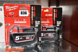 Two boxed as new Milwaukee M18B5 18V 5.0Ah lithium-ion batteries.