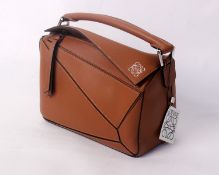 One lady's as new Loewe Classic Calf Small Puzzle Bag in tan.