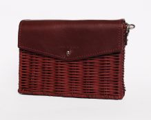 An as new Wicker Wings minis shoulder bag in burgundy.