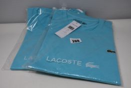 Two as new Lacoste t-shirts (US M, XL).