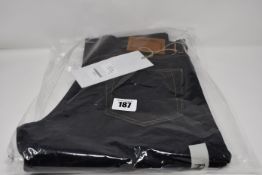 A pair of as new Blackhorse Lane Ateliers E8 relaxed slim tapered indigo jeans (30 - RRP £200).