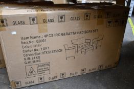 A boxed as new 4-piece Rattan garden sofa and table set in brown.