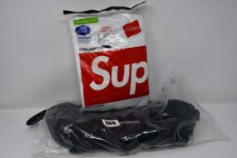 An as new Supreme Cordura mesh waist bag and a pack of three Supreme Hanes tagless T-shirts (S).