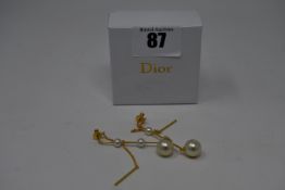 A pair of as new Christian Dior pearl drop earrings.