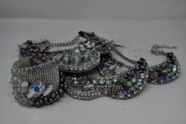 Four Swarovski crystal evening dress necklaces with leather backs and one cuff (No Tags).