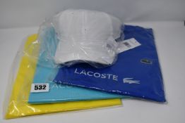 Three as new Lacoste t-shirts (US S, 2 x L) and a Lacoste baseball cap.