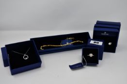 Four boxed as new Swarovski Jewellery to include one Swarovski Woman Rose gold Crystal (P.N: