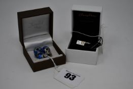 Four pre-owned Pandora charms and a boxed as new Disney Parks charm.