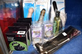 Five CalExotics gold metal cock rings, a CalExotics Cleaner Torpedo anal douche, three CalExotics