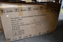 A boxed as new 4-piece Rattan garden sofa and table set in grey.