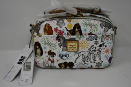 An as new Dooney & Bourke Paw Prints bag decorated with Disney dogs (RRP $228).