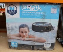 A boxed as new Netspa SpaRo inflatable round spa in black.