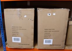 Two boxed as new Puma executive chairs in black.