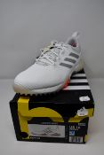 A pair of as new Adidas Codechaos golf shoes (UK 9.5).
