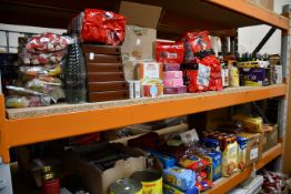 Two shelves of miscellaneous food beverage and related items to include Nongshin Ramon noodles,