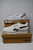 Two pairs of as new Reebok trainers; Classic leather (UK 11) and Act 300 (UK 8).