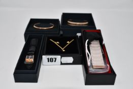 Two Daniel Wellington Classic Bracelets in rose gold, one MVMT Prism Charm Bracelet in rose gold and