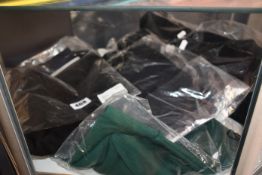 Four items of as new Fred Perry clothing; a slim fit polo (M), texture turtleneck jumper (Size