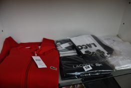 Six items of as new Lacoste clothing; four polo shirts (Sizes 3, 5, 6, 7), hoodie (Size 3 - RRP £90)