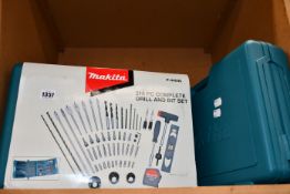 Two boxed as new Makita 216-piece drill and bit sets.