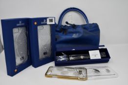 Assorted Swarovski items; a Stand Symbol S bracelet, four iPhone 7 cases (Two unboxed) and a