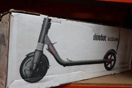 A pre-owned Ninebot Kickscooter by Segway (No charger).