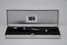 A Snap On ballpoint pen in black and silver with presentation case.