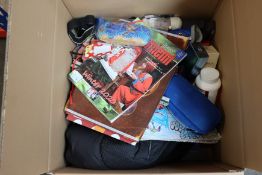 A box of miscellaneous items to include toys, perfumes, books and a box of glasses to include
