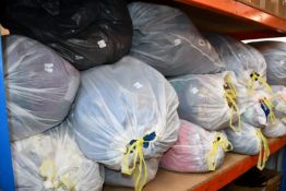 Fourteen bags of clothing and related items.