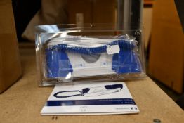 One boxed as new Covidien Genius 3 tympanic thermometer and base.