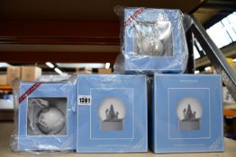 Two Wedgewood Christmas Snow Globes and two Wedgewood Christmas Baubles, all boxed as new.