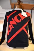 An as new Moncler pullover (M).