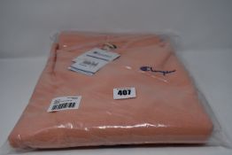 Two as new Champion relaxed hoodies with chest logo in light pink (Both L).