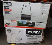 A boxed as new Hyundai lawn mower and an Ozito garden roller.