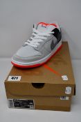 A pair of as new Nike SB Dunk Low Pro ISO trainers (UK 8).