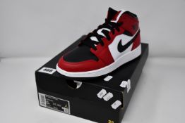 A pair of as new Nike Air Jordan 1 Mid (GS) (UK 4.5).