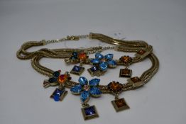 Two Loris Azzard necklaces with Jewelled flower decoration.
