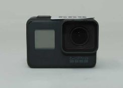 A pre-owned GoPro HERO5 Black Waterproof 4K Camera with one battery.