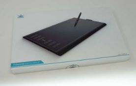 A boxed as new Huion New 1060 Plus Graphics Drawing Tablet. 10 x 6.25inch Digital Drawing tablet