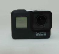 A pre-owned GoPro HERO7 Black (Untested, no battery. Sold as seen).
