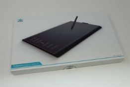 A boxed as new Huion New 1060 Plus Graphics Drawing Tablet. 10 x 6.25inch Digital Drawing tablet