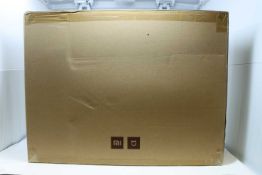 A boxed as new Mi Robot SDJQR02RR Vacuum Cleaner in White. Bagless, HEPA filter, 0.42litres.