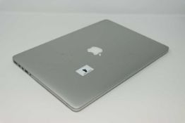 A pre-owned MacBook Pro A1398 sold for parts (Serial: C02KR3S4FFT1) (Does not power on, liquid