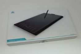 A boxed as new Huion New 1060 Plus Graphics Drawing Tablet. 10 x 6.25inch Digital Drawing tablet