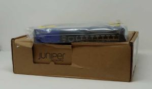A boxed as new Juniper SRX210 Services Gateway (Model: SRX210HE2) (Inner packaging sealed. No